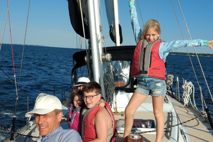 a family posing for a picture on the boat