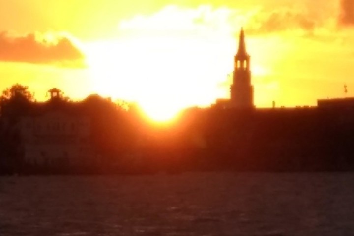 a sunset over a body of water