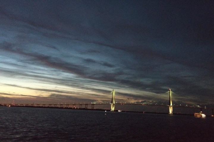 a large body of water with a city in the background