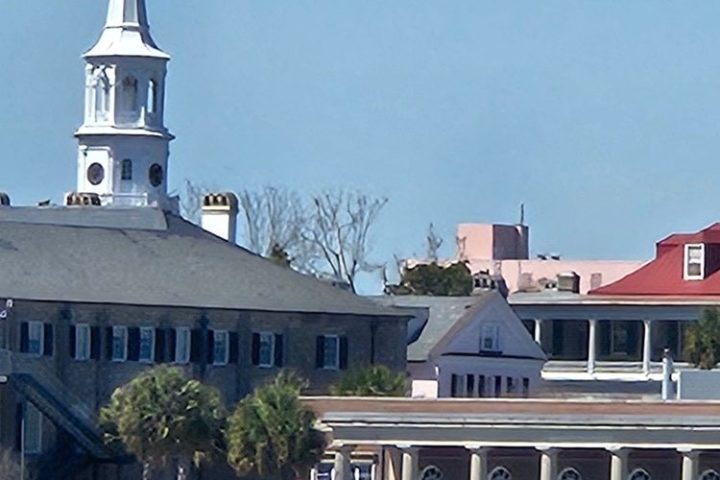 a small clock tower in front of a house