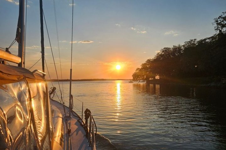 a boat is docked next to a body of water