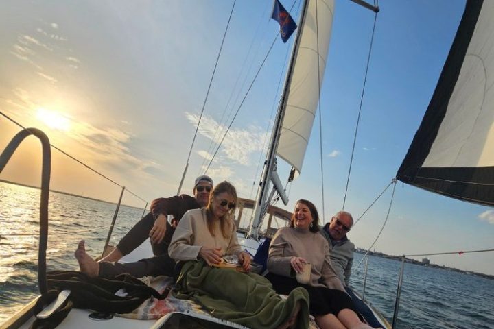 a group of people on a boat in the water