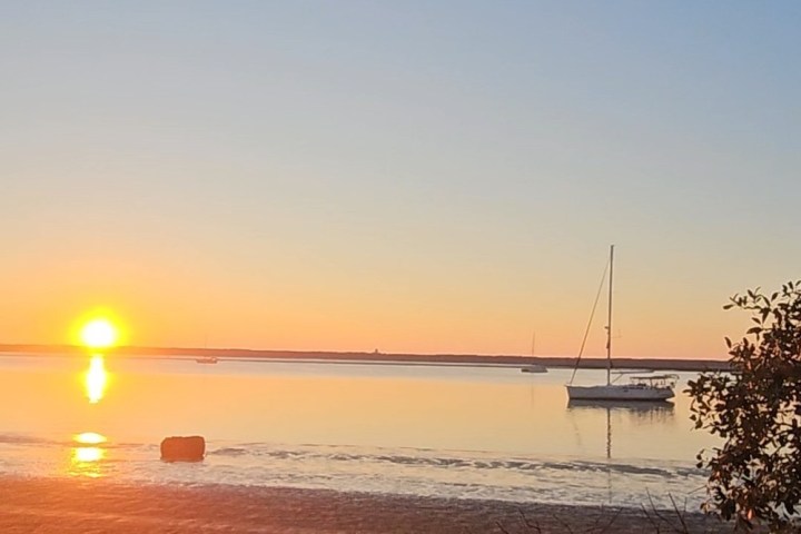 a sunset over a body of water