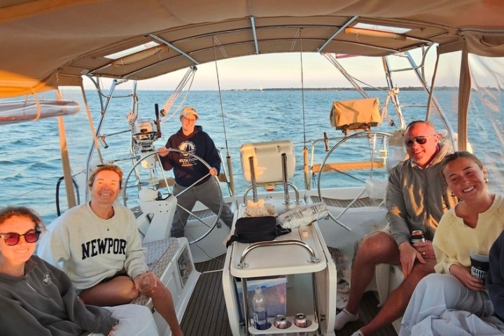 a group of people sitting on a boat