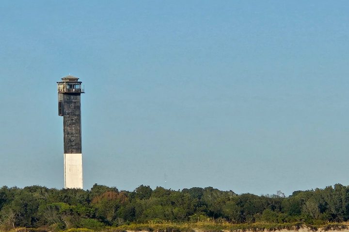 a large clock tower towering over a body of water