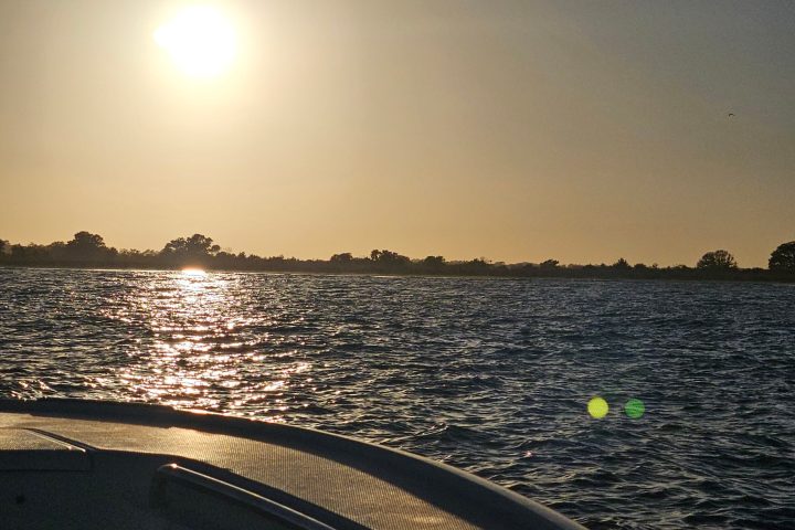 a sunset over a body of water