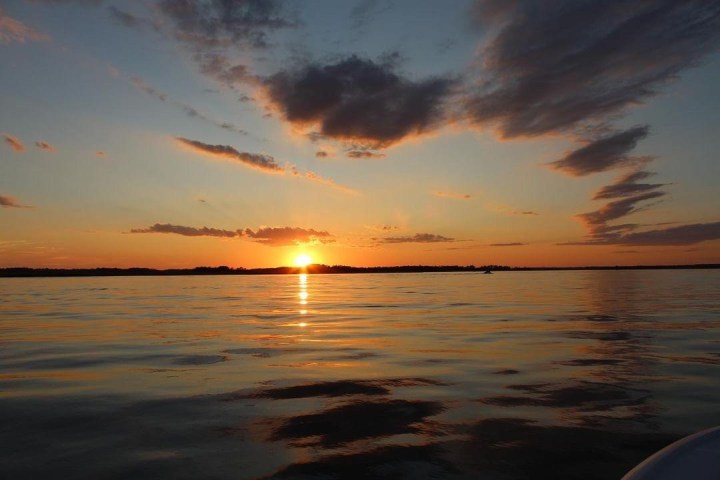 a sunset over a body of water