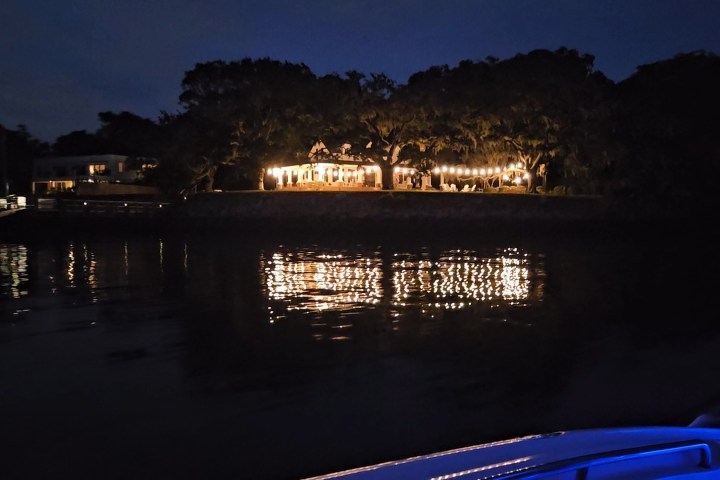 a view of a city at night in front of a body of water