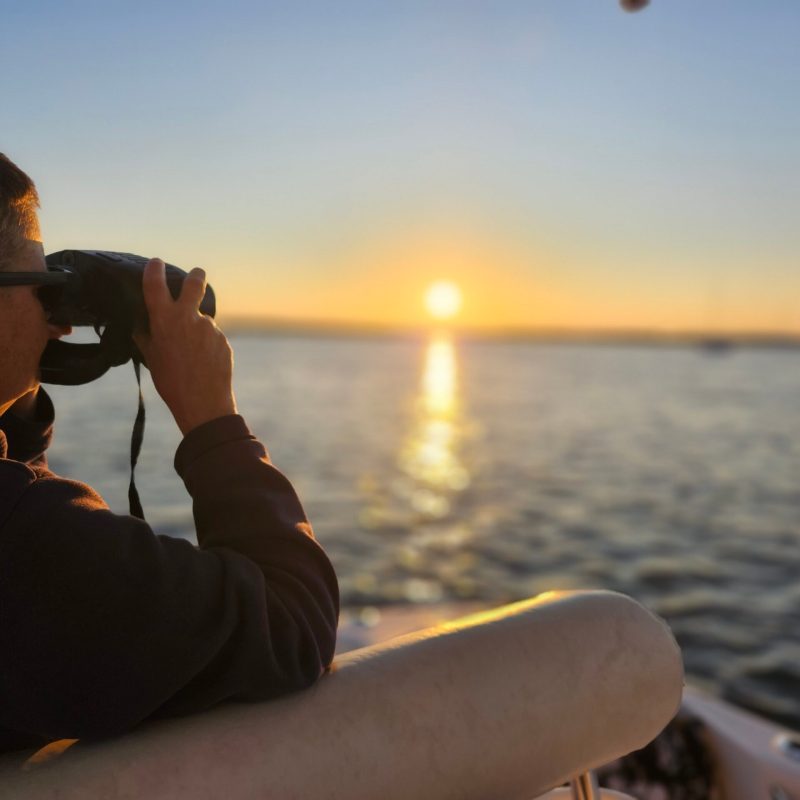 a man talking on a cell phone in the water