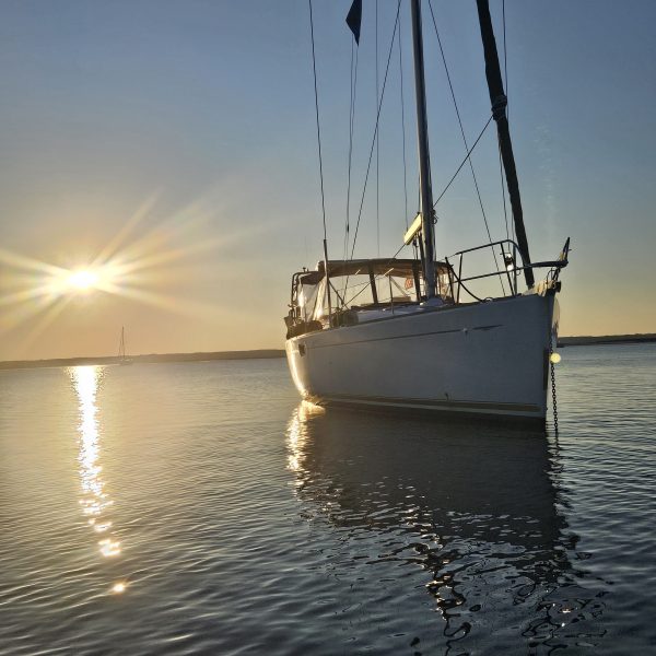 a close up of a boat next to a body of water