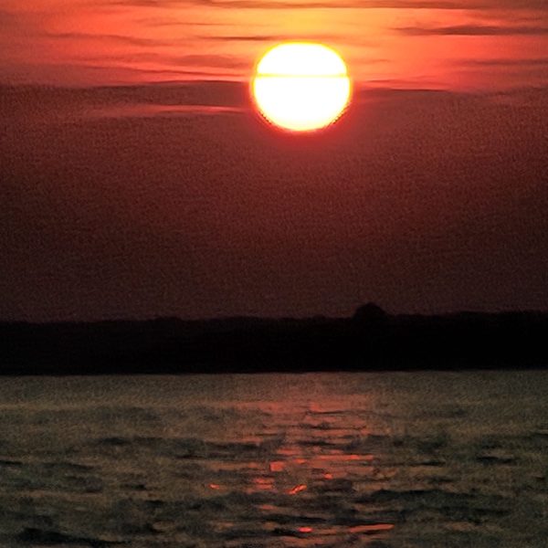 a sunset over a body of water