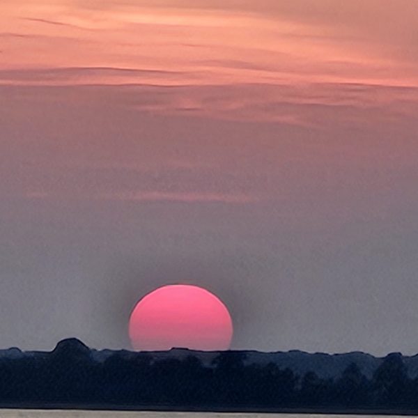 a sunset over a body of water