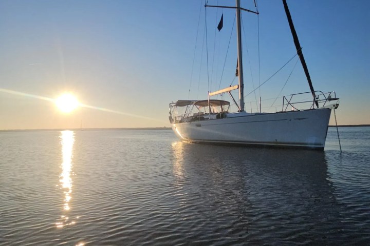 a small boat in a large body of water
