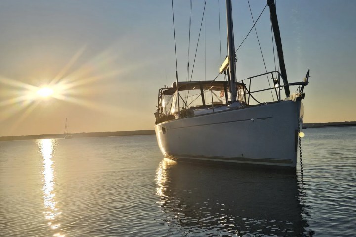 a close up of a boat next to a body of water