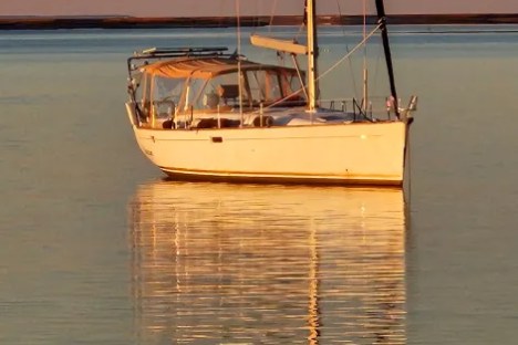 a small boat in a large body of water