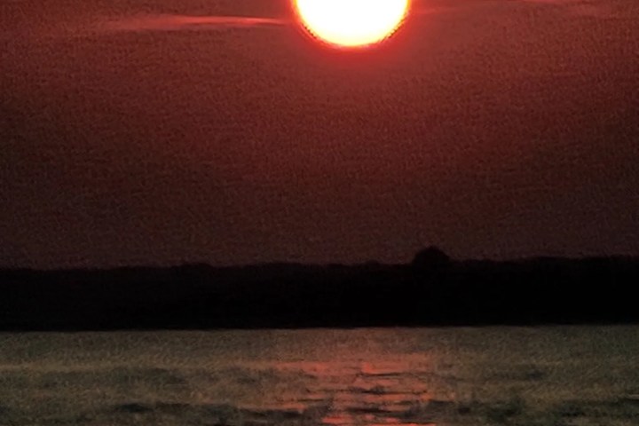 a sunset over a body of water