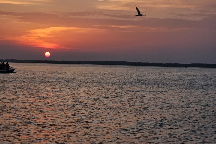 a sunset over a body of water