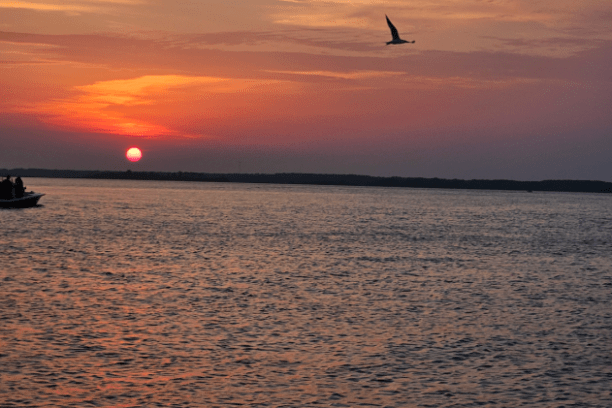 a sunset over a body of water
