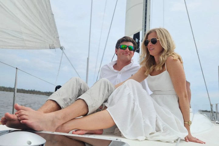 a man and a woman sitting on a boat